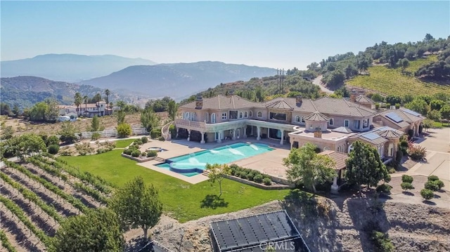 view of swimming pool with a mountain view