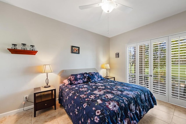 bedroom with ceiling fan and light tile patterned floors