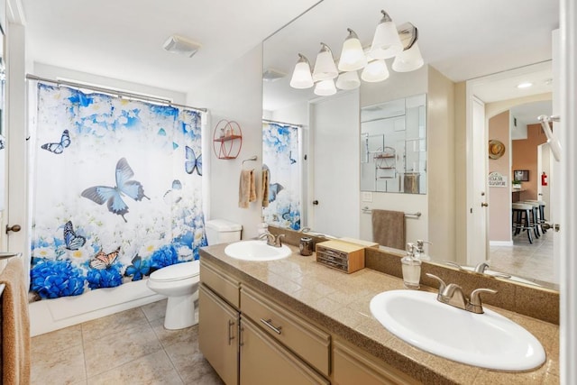 full bathroom with tile patterned flooring, vanity, shower / tub combo, and toilet