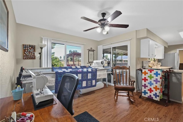 office space featuring hardwood / wood-style flooring and ceiling fan