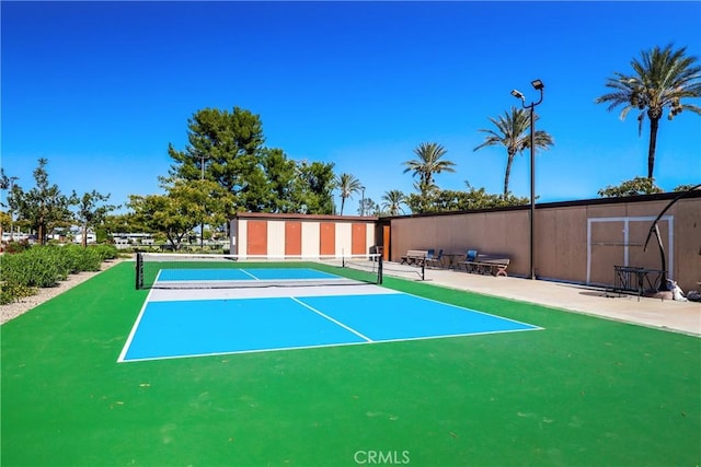 view of sport court featuring basketball hoop