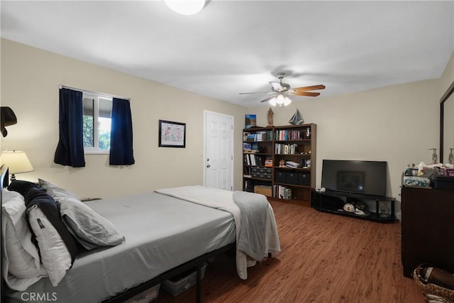 bedroom featuring ceiling fan and wood-type flooring