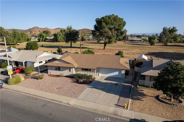 birds eye view of property featuring a mountain view