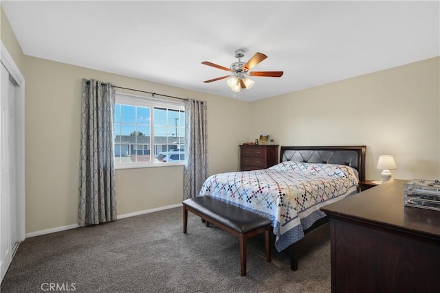 bedroom with dark colored carpet and ceiling fan