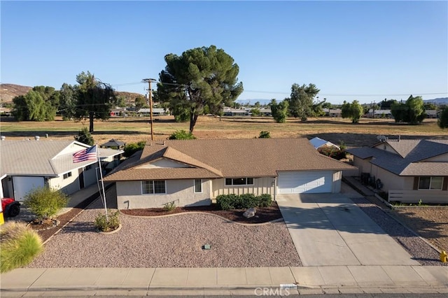 ranch-style home featuring a garage