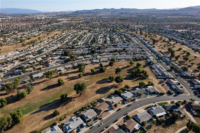 birds eye view of property featuring a mountain view