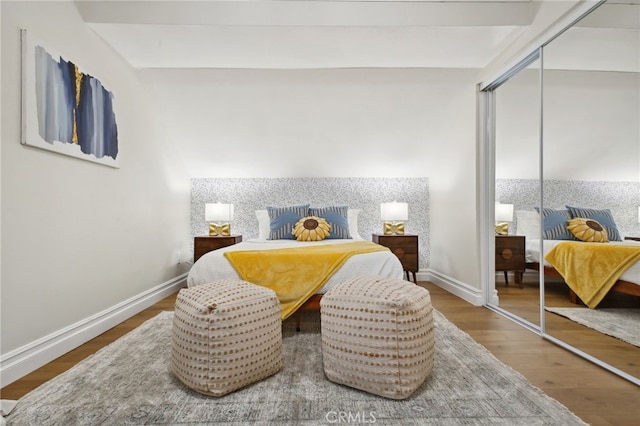 bedroom featuring a closet and hardwood / wood-style floors