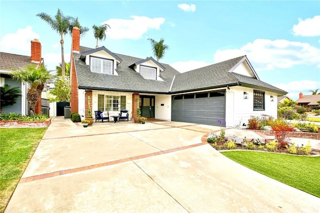 view of front of home featuring a garage and a front yard