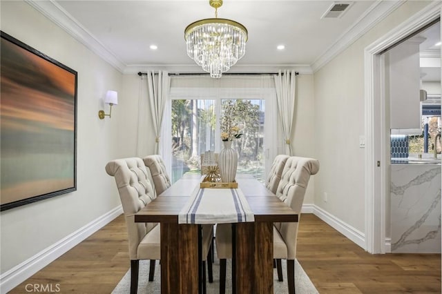 dining space with dark hardwood / wood-style flooring, plenty of natural light, and crown molding