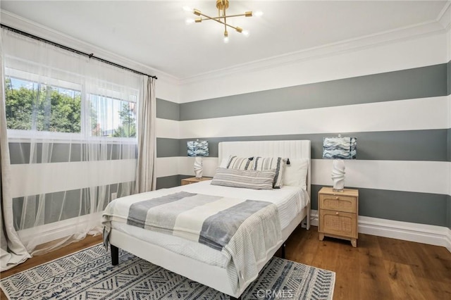 bedroom with crown molding, dark wood-type flooring, and an inviting chandelier