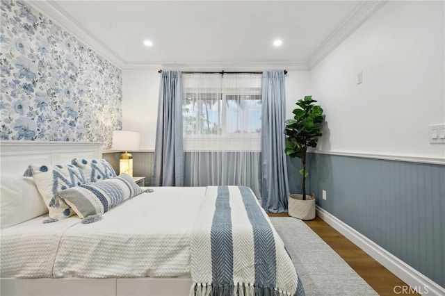 bedroom with crown molding and dark wood-type flooring