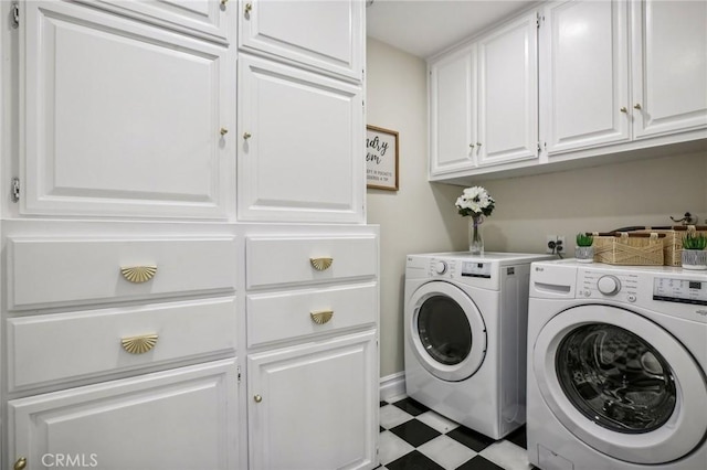 laundry room featuring cabinets and separate washer and dryer