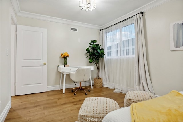 office featuring light hardwood / wood-style floors and crown molding