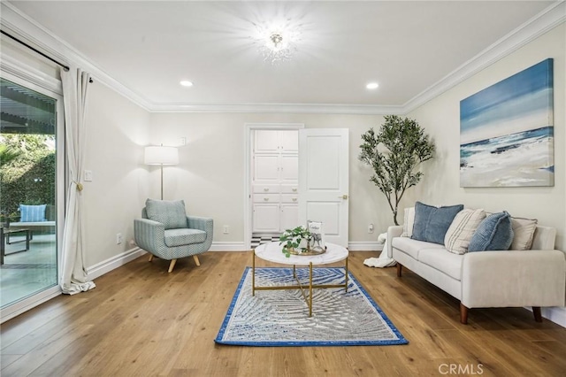 living room featuring crown molding and hardwood / wood-style flooring