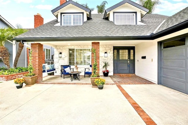 exterior space with a garage and covered porch