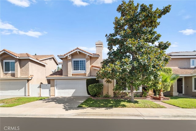 mediterranean / spanish-style house featuring a garage