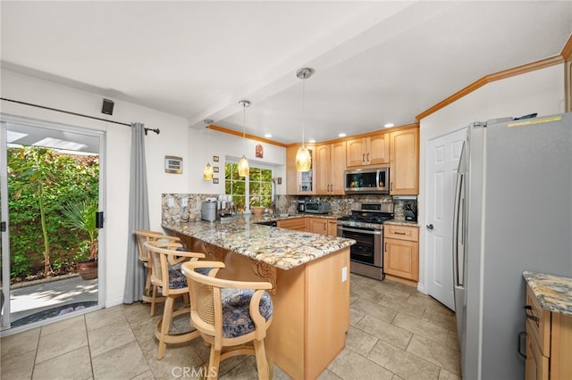 kitchen with light stone countertops, appliances with stainless steel finishes, decorative backsplash, kitchen peninsula, and a breakfast bar