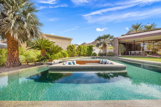 view of swimming pool with a jacuzzi