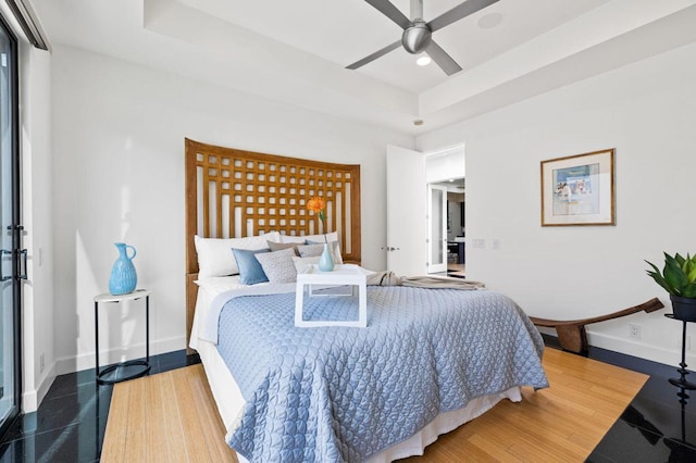 bedroom featuring hardwood / wood-style flooring and ceiling fan