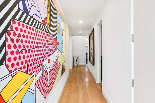 hallway with hardwood / wood-style floors