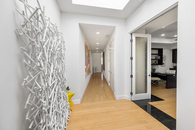 hallway featuring wood-type flooring