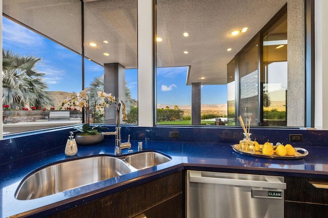 patio terrace at dusk featuring a mountain view and sink