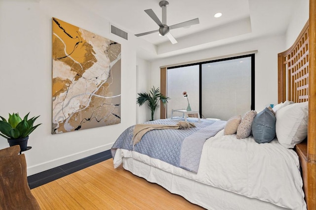 bedroom with ceiling fan and wood-type flooring