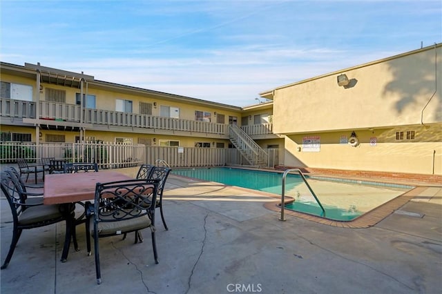 view of pool featuring a patio area