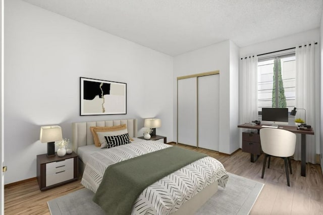 bedroom featuring a textured ceiling, light hardwood / wood-style floors, and a closet