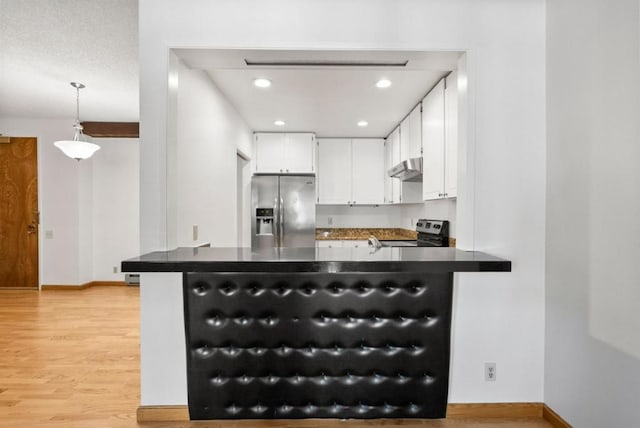 kitchen with hanging light fixtures, light wood-type flooring, white cabinetry, kitchen peninsula, and stainless steel appliances