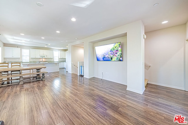 living room with sink and hardwood / wood-style flooring