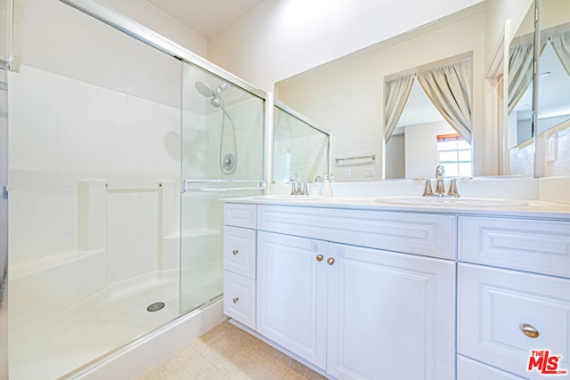 bathroom featuring vanity and walk in shower