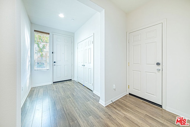 entryway with light hardwood / wood-style floors