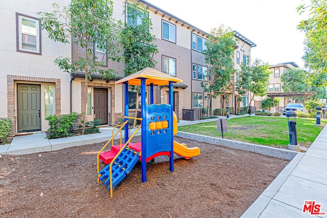 view of jungle gym with a yard