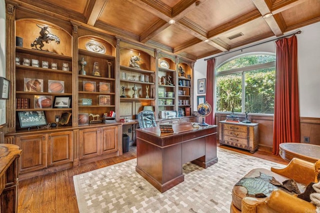 office space featuring light hardwood / wood-style flooring, beamed ceiling, and coffered ceiling