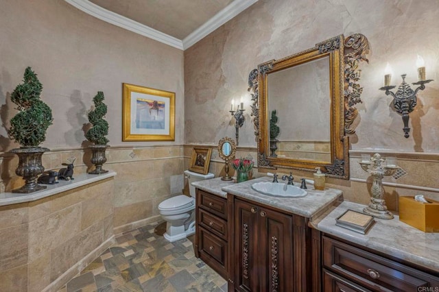 bathroom with vanity, toilet, and crown molding