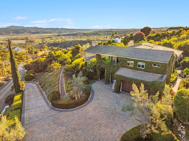 drone / aerial view featuring a mountain view