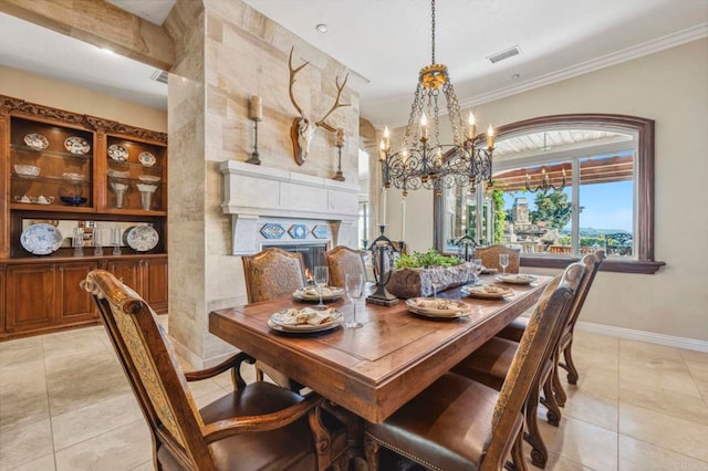 dining space featuring a premium fireplace, ornamental molding, light tile patterned floors, and a notable chandelier