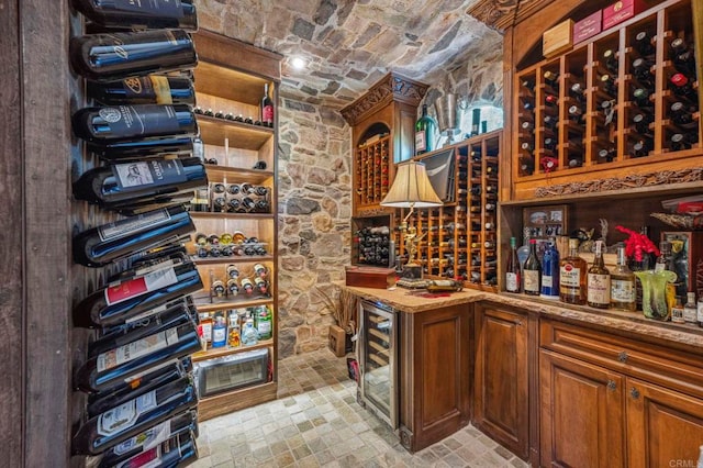 wine cellar featuring brick ceiling and beverage cooler