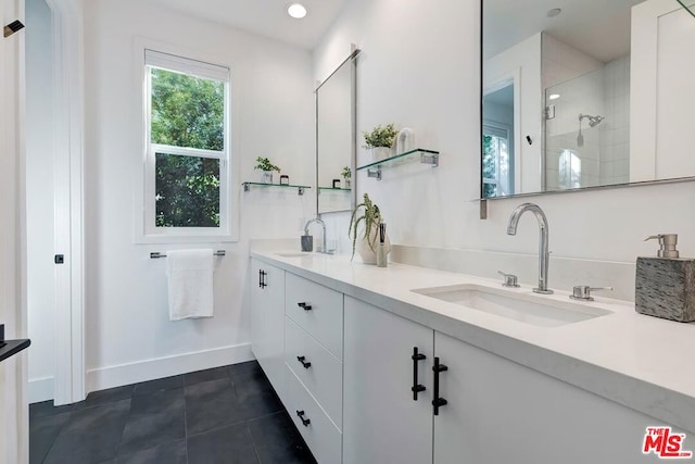 bathroom with tile patterned flooring and vanity