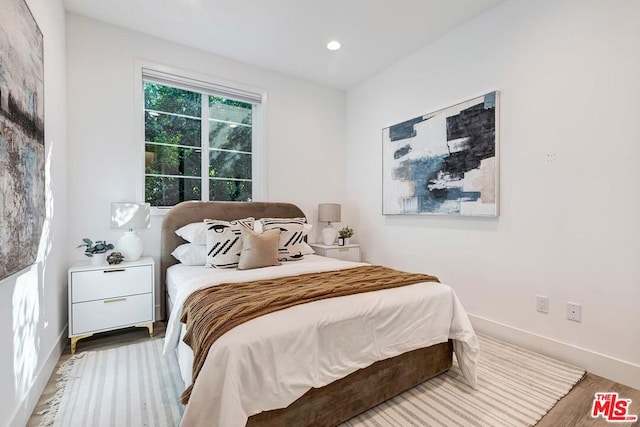 bedroom featuring hardwood / wood-style floors