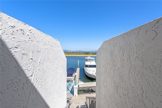 property view of water with a dock