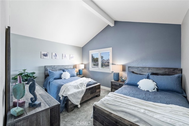 bedroom with lofted ceiling with beams and carpet floors