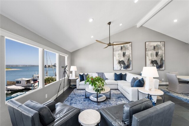 living room with vaulted ceiling with beams, a water view, and ceiling fan