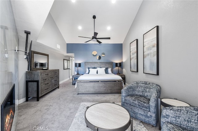 carpeted bedroom featuring lofted ceiling and ceiling fan