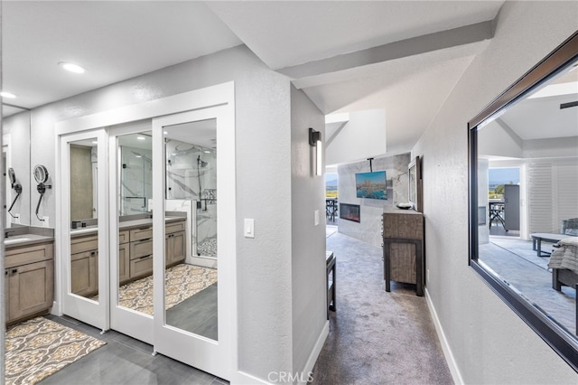 bathroom with vanity and an enclosed shower