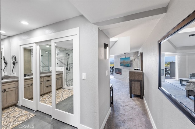 interior space with baseboards, a wealth of natural light, and a textured wall