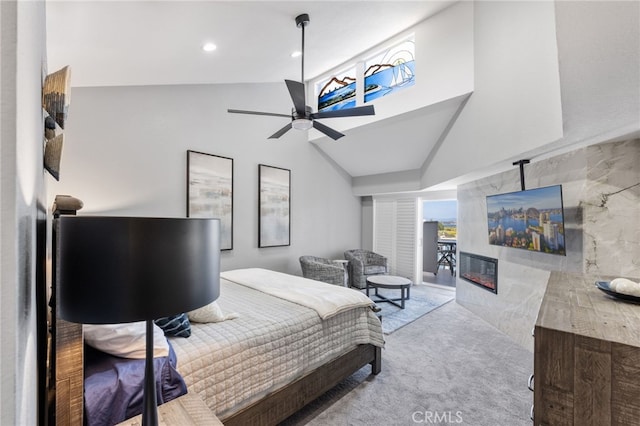 carpeted bedroom with lofted ceiling and ceiling fan