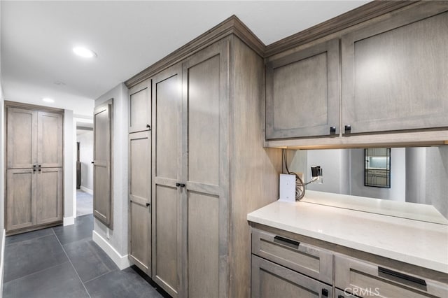 kitchen featuring dark tile patterned floors