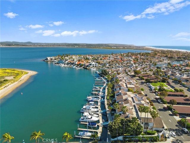 birds eye view of property featuring a water view and a view of the beach